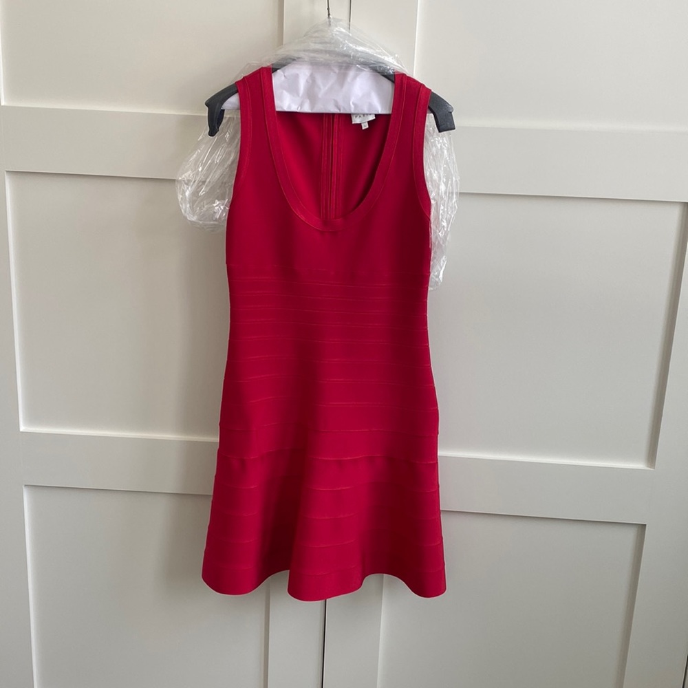 Herve Leger Paris red band aid scoop neck, sleeveless with fluted bottom.